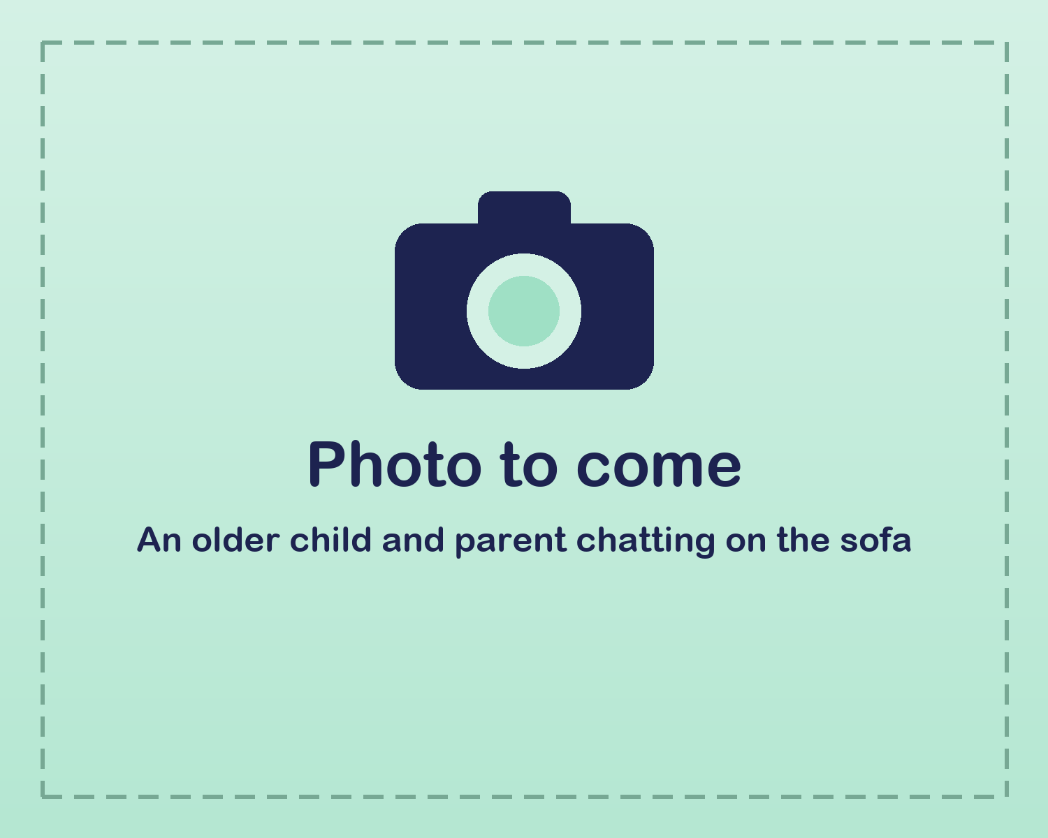 An older child and parent chatting on the sofa